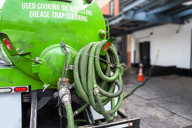 pumping out a heavy-duty grease trap at a restaurant in Bloomington, CA